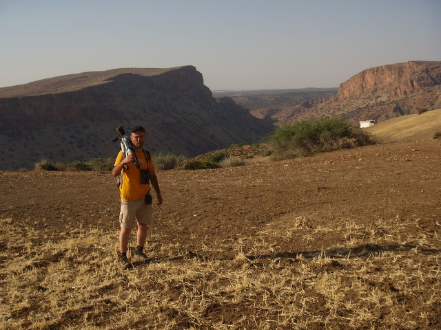 Mohamed Amezian and the rugged landscape in the background, Middle Atlas, Morocco